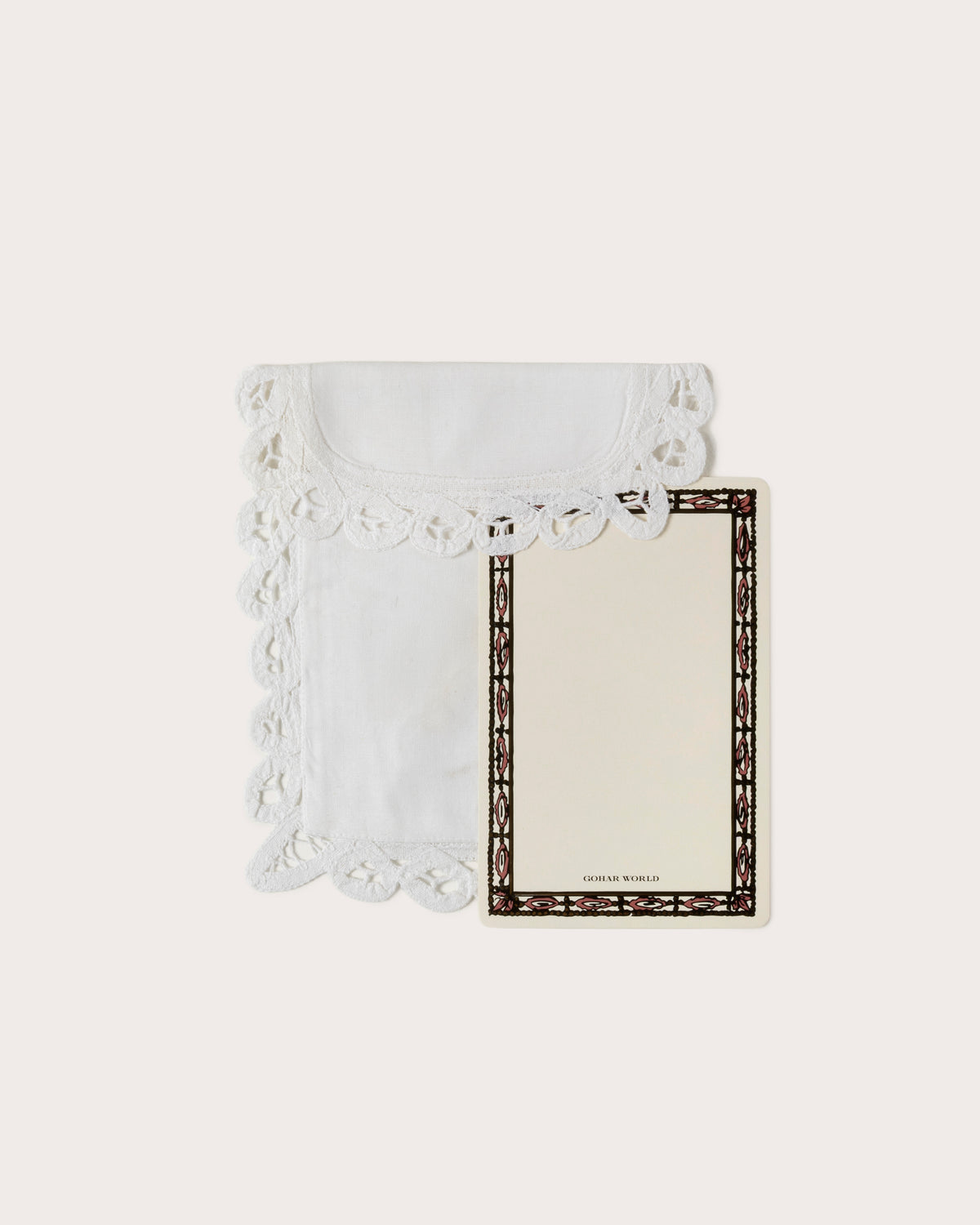 White cotton envelope with Battenberg lace and a Gohar World note card